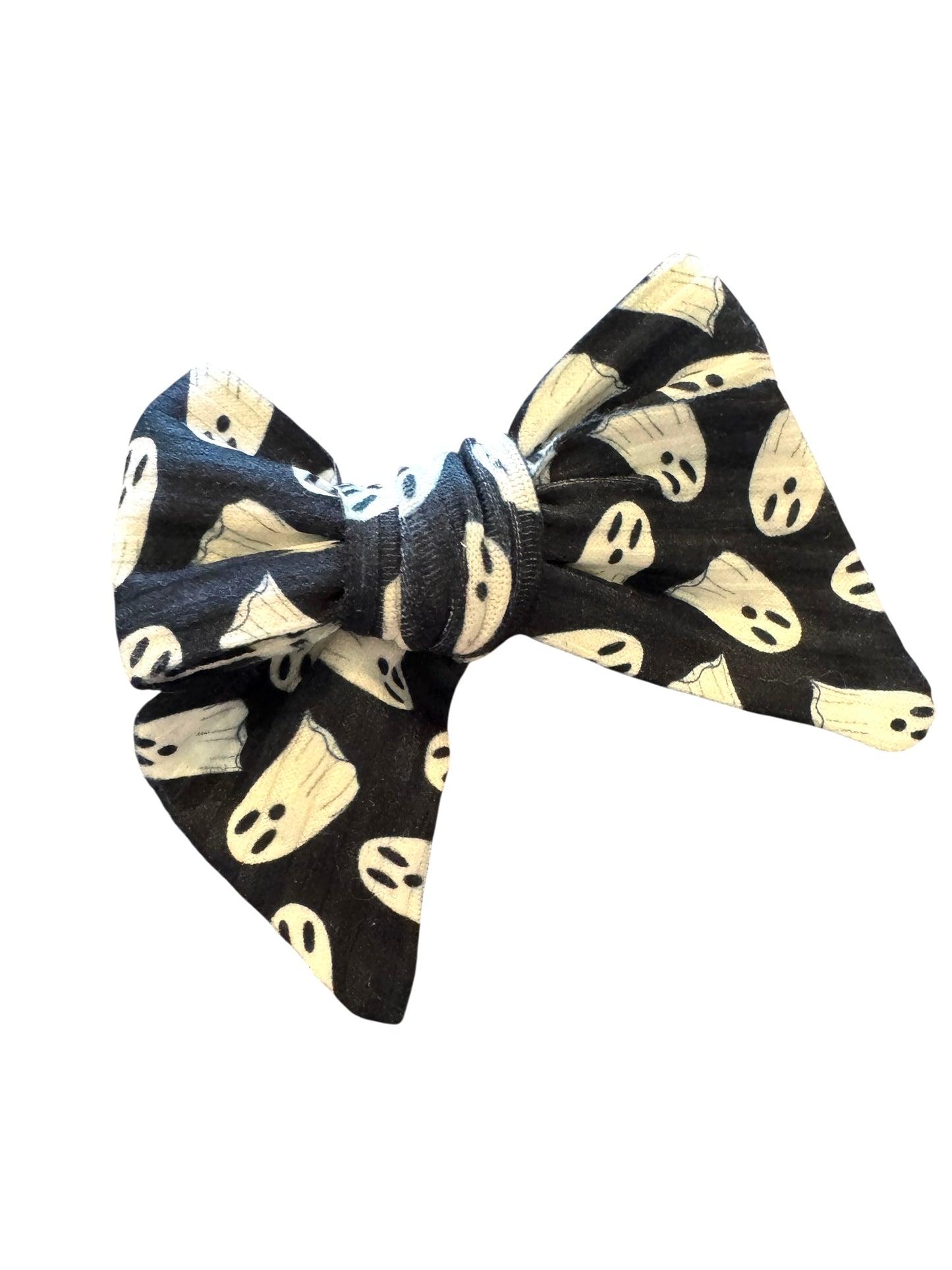 Black hair bow with white ghost pattern on a white background