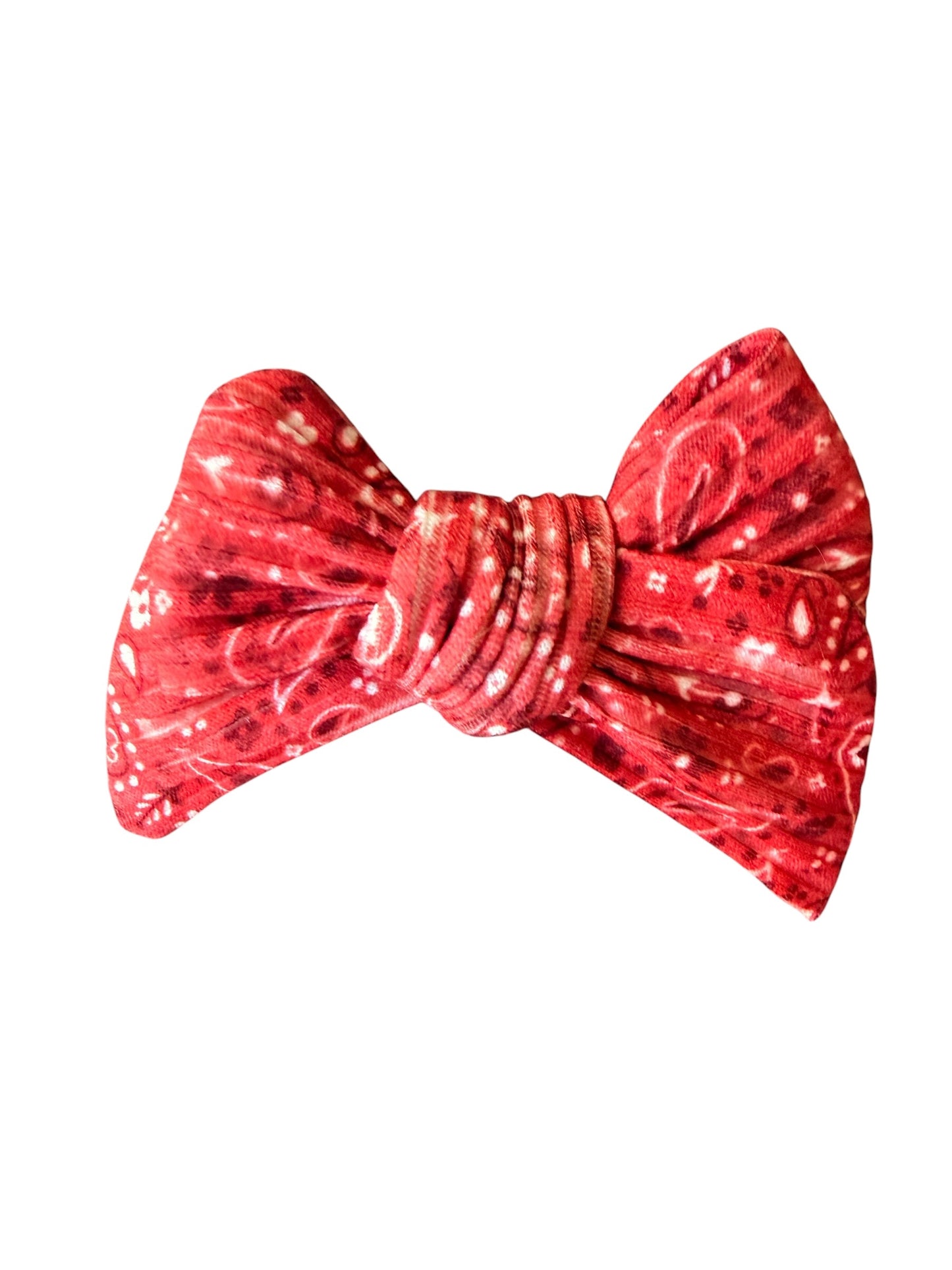 A red and white paisley patterned bow tie, centered on a plain white background.