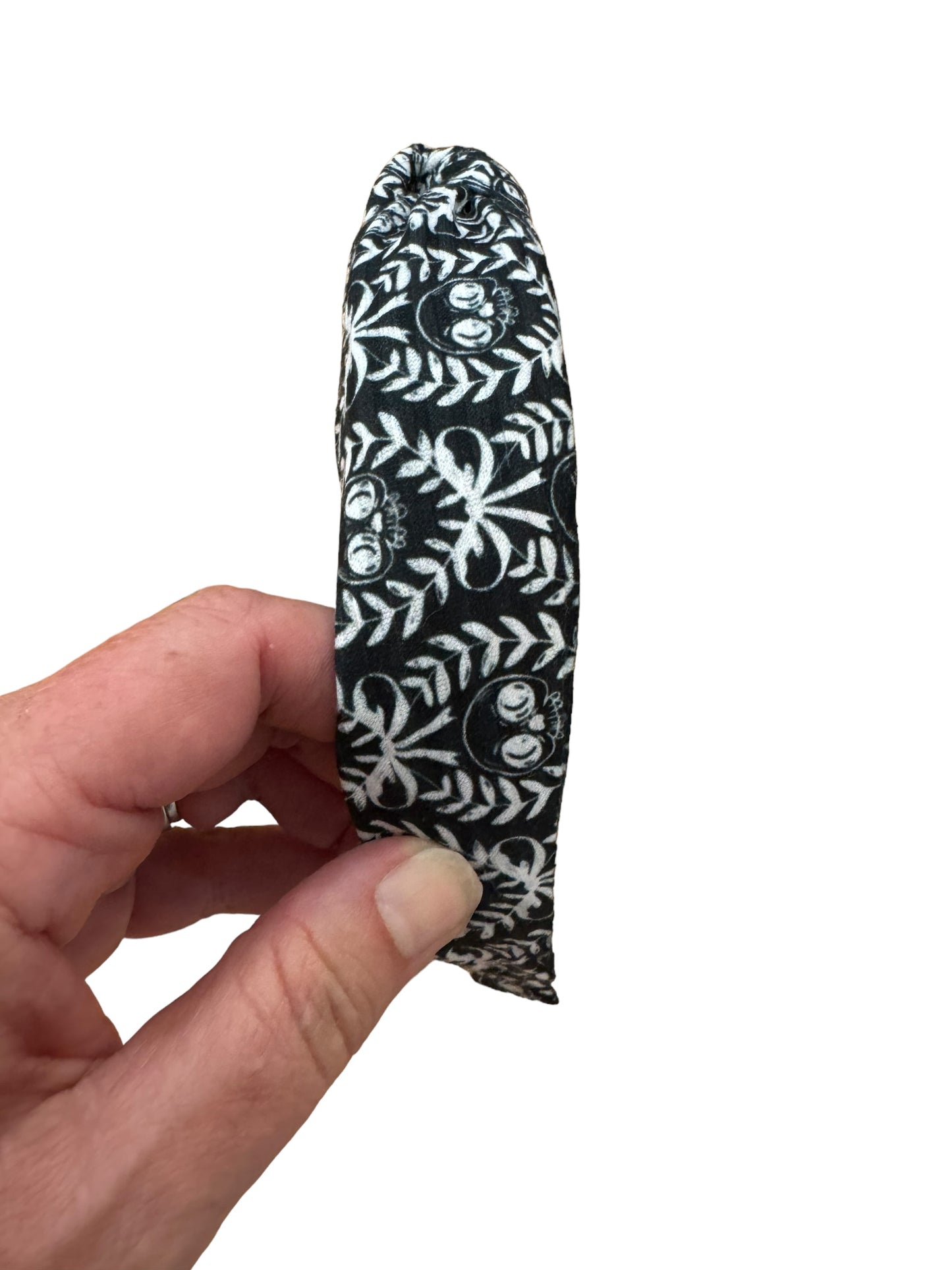 A set of black and white skeleton patterned headband