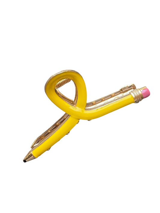 Yellow pencil claw clip with a unique design on a white background