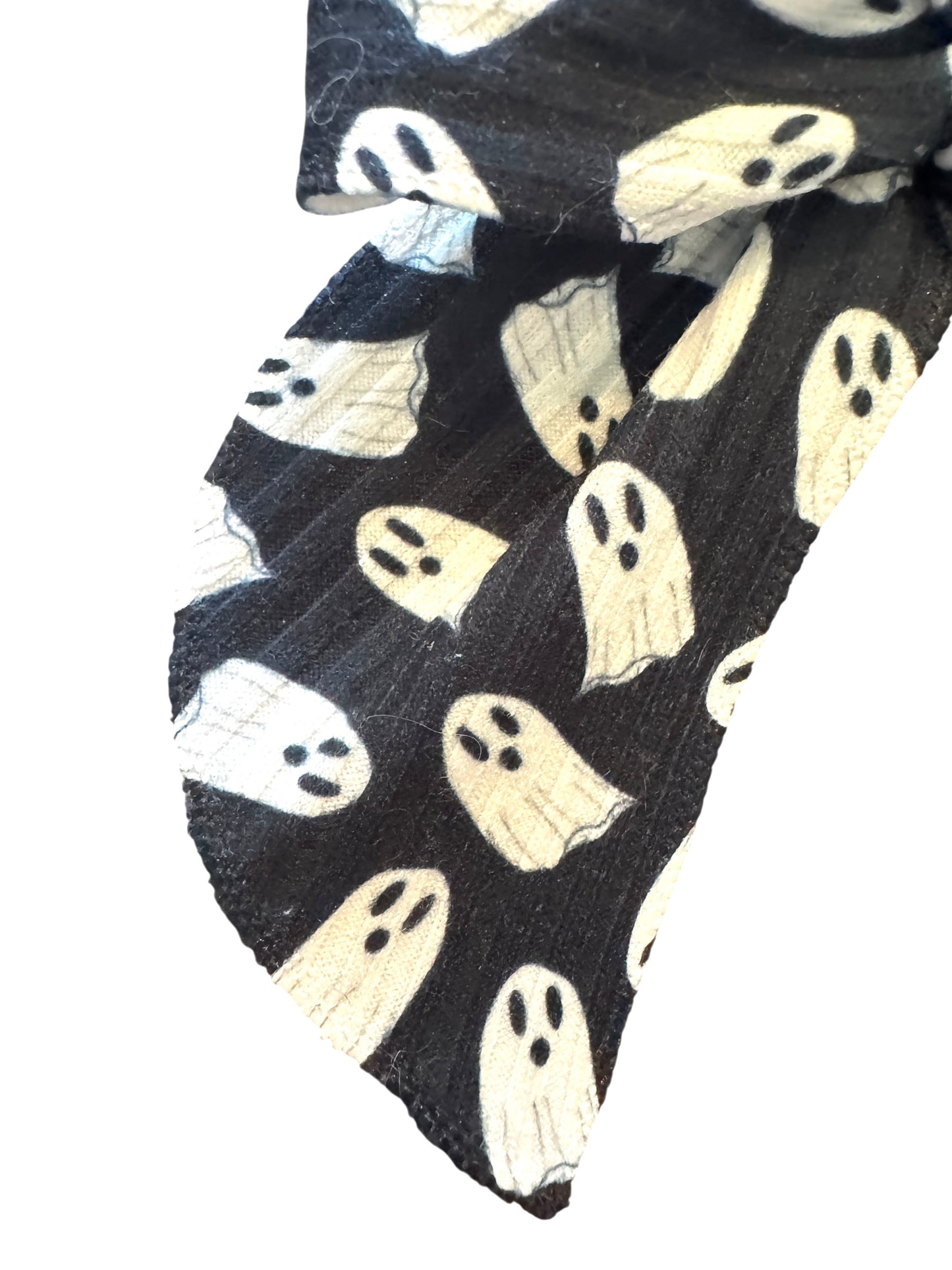 Black fabric with white ghost patterns on a white background