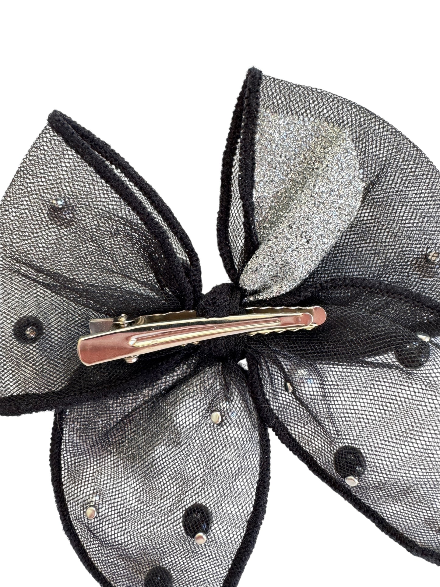 Black and silver hair bow with a clip on a white background