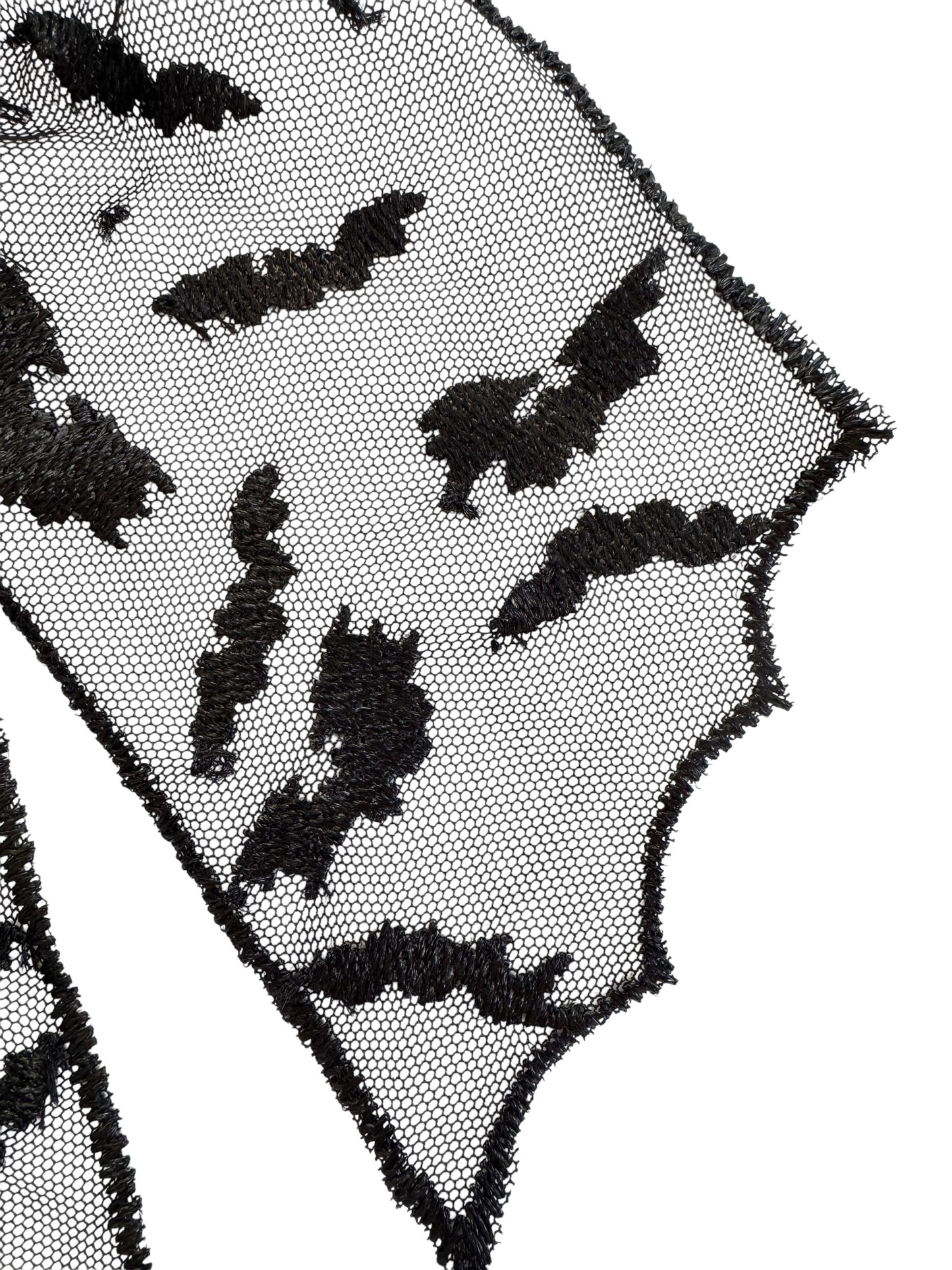 Black bat patterns on a sheer black fabric background
