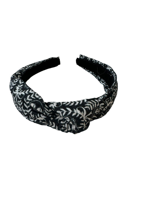 A set of black and white skeleton patterned headband