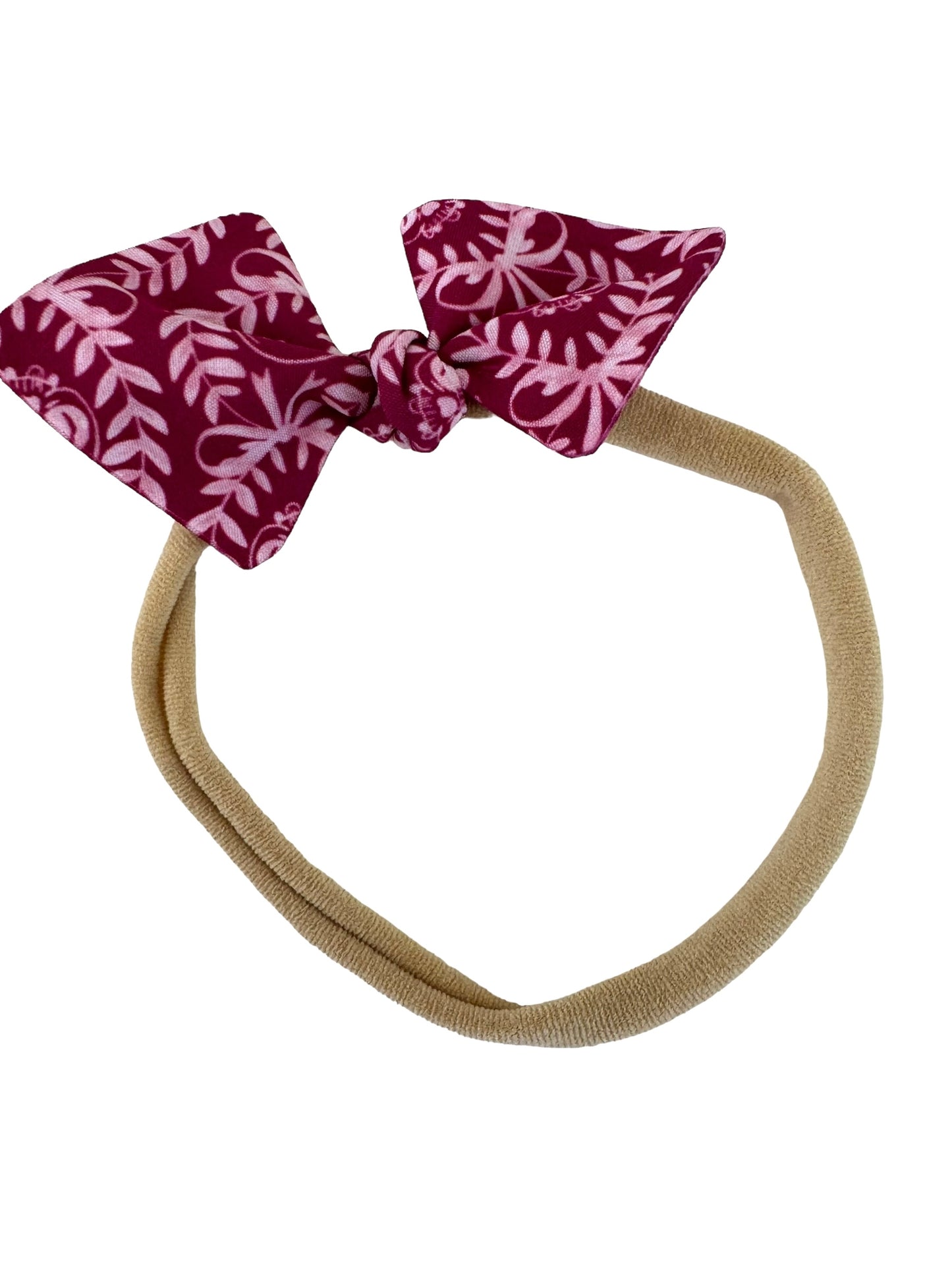 dark pink Halloween mini bows on a nylon headband for babies