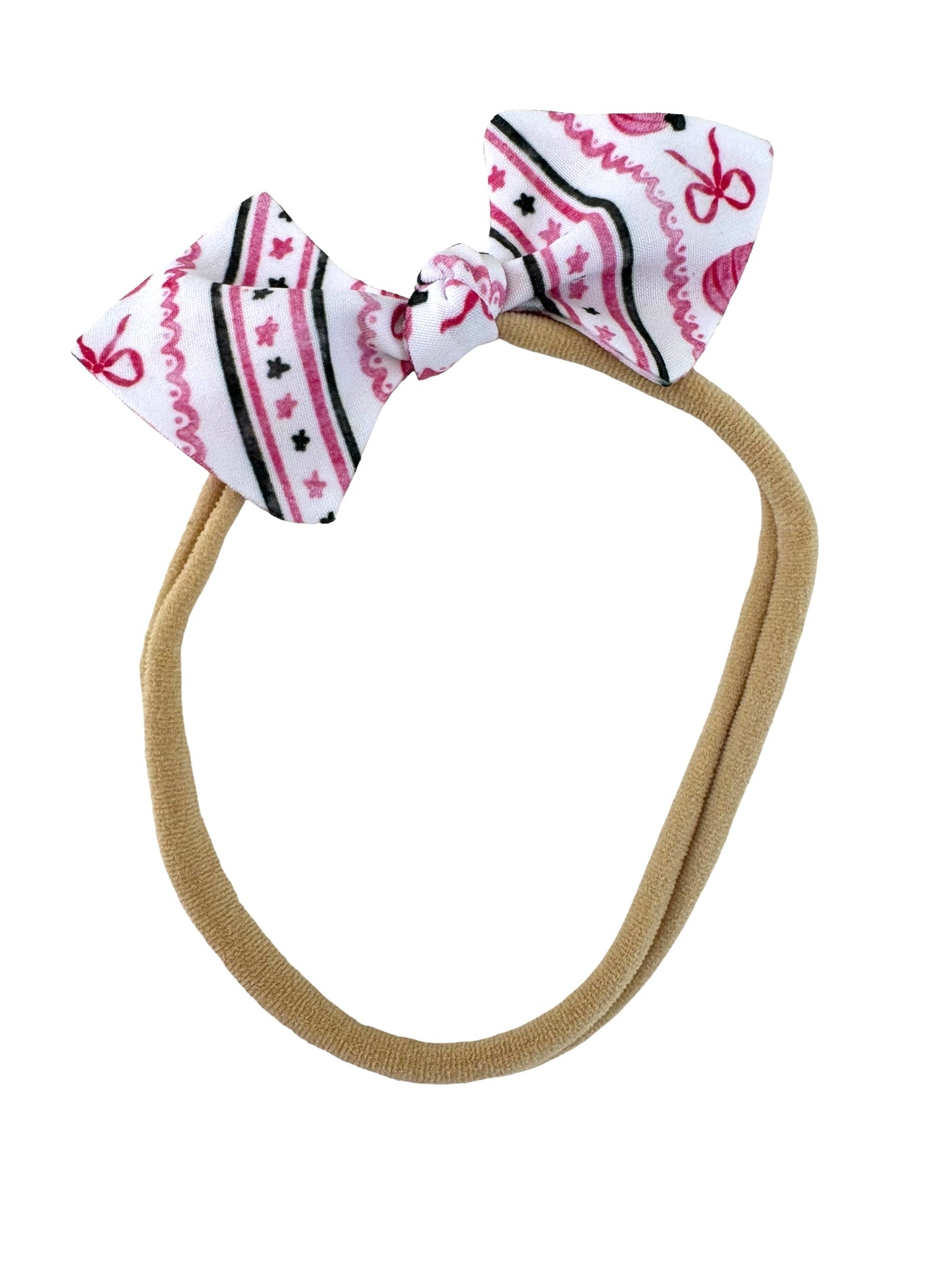 pink halloween mini bows on a nylon headband for babies