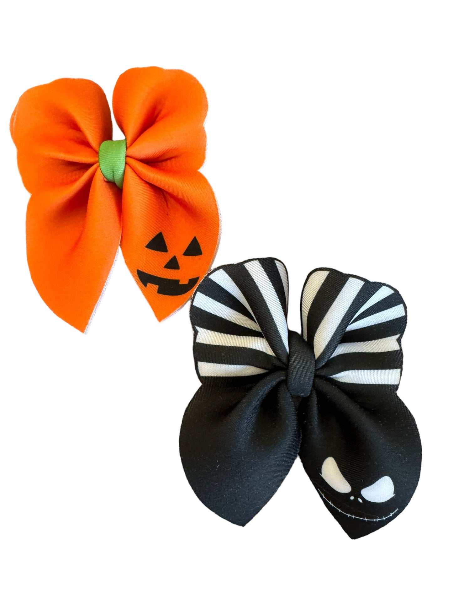 An orange pumpkin-shaped bubble hair bow with a jack-o-lantern face design in the center, attached to an alligator clip. along with a Jack Bow
