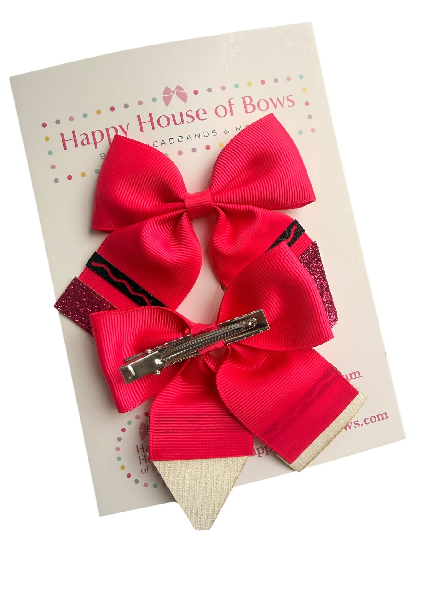 A bright pink and red hair bow set with a silver metal clip, displayed on a branded backing card that reads Happy House of Bows.