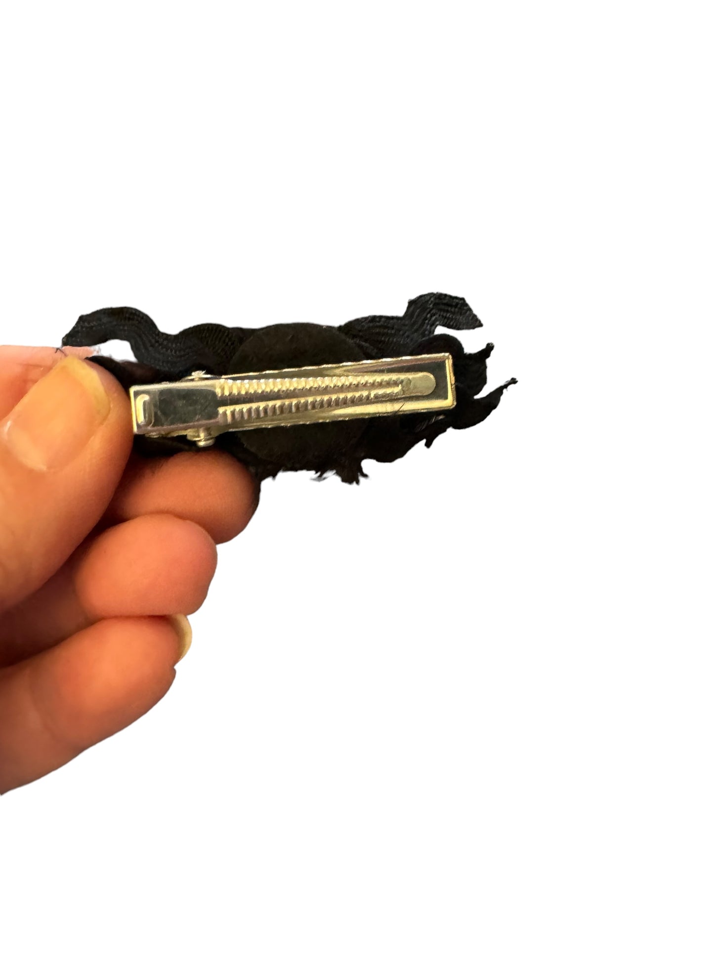 back of a spider clip showing an alligator clip