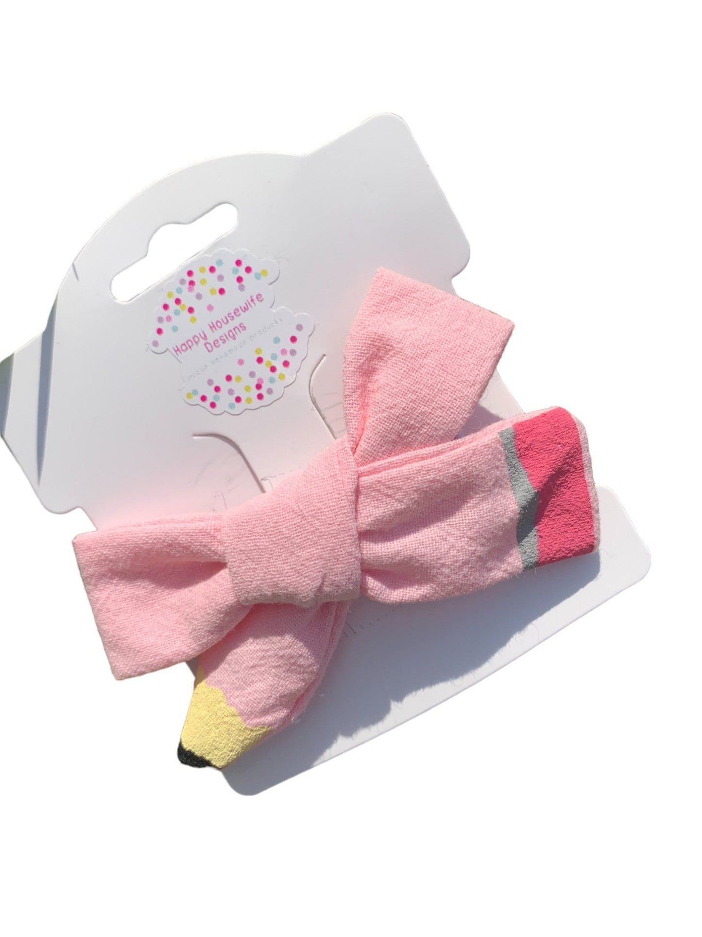 pink pencil bow on white background