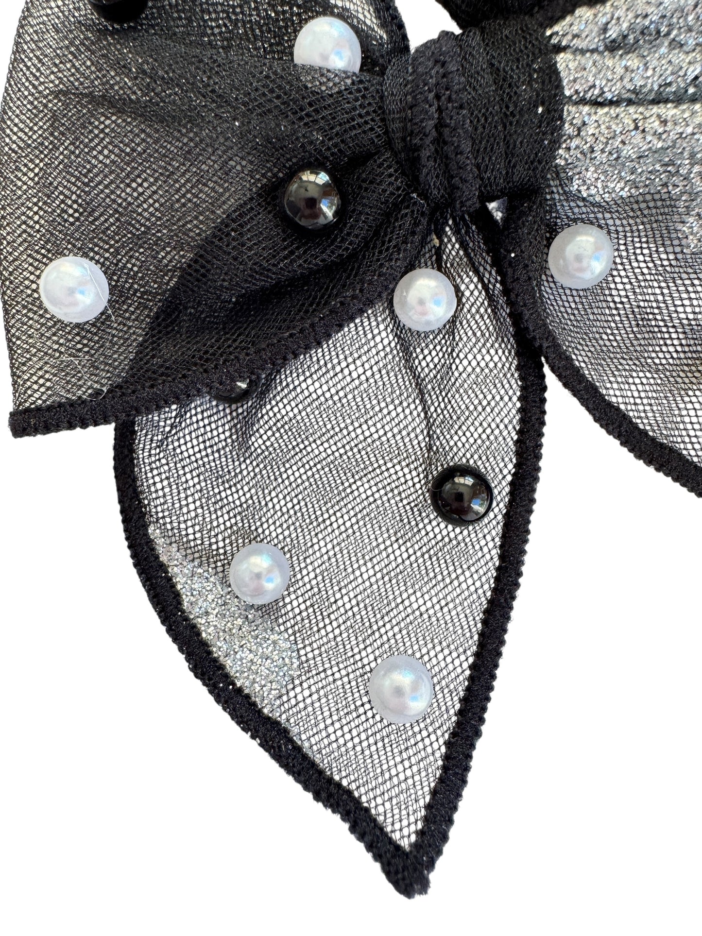 Black hair clip with pearl-like beads on a white background