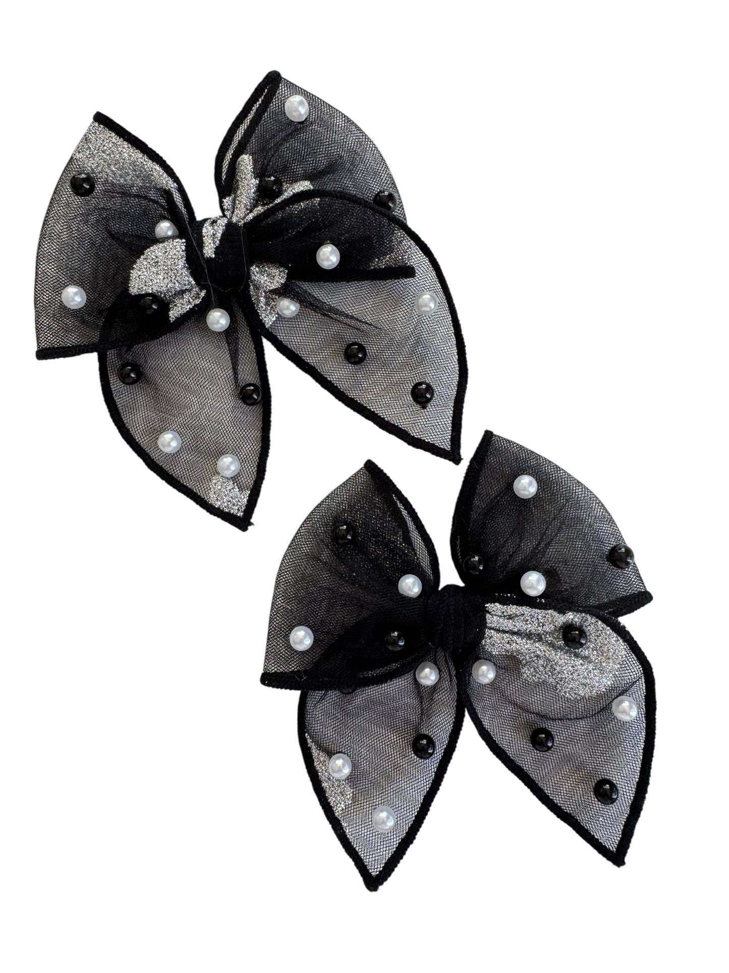Black hair bows with pearl-like embellishments on a white background