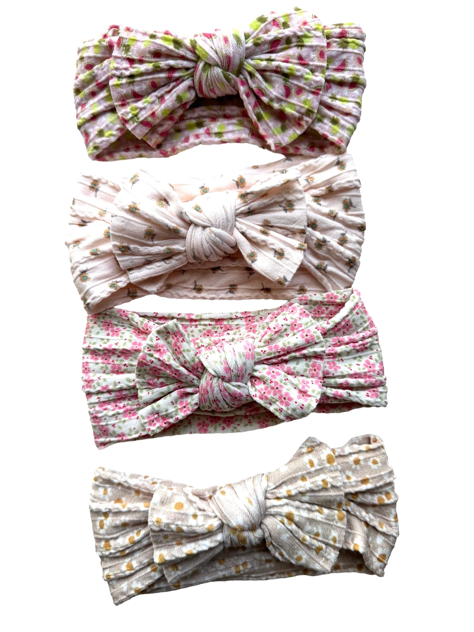 A few floral patterned nylon headband for babies with large bow