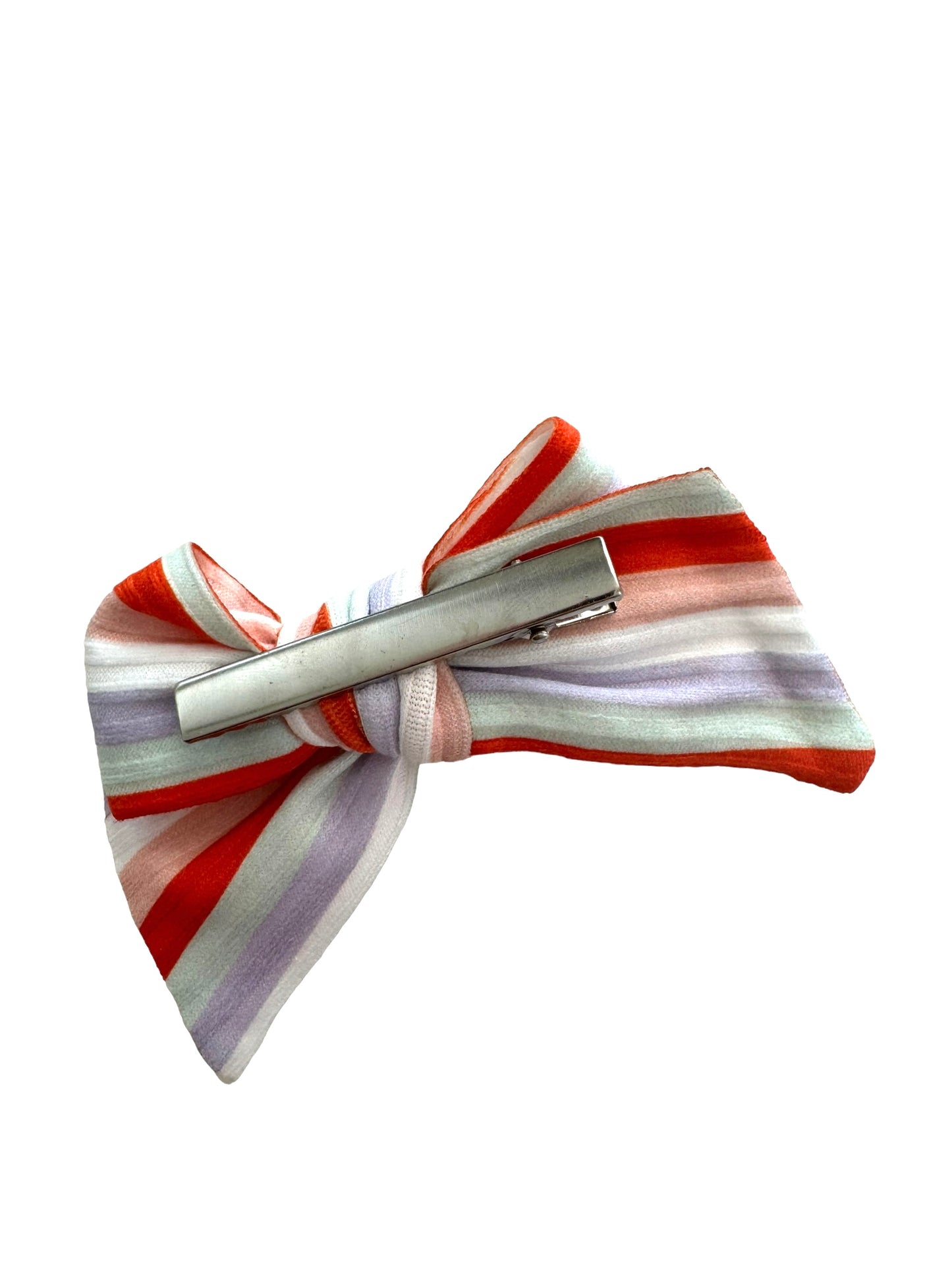 one hair bows with fall striped patterns, one in orange and the other in purple, displayed on a white surface showing hair clip