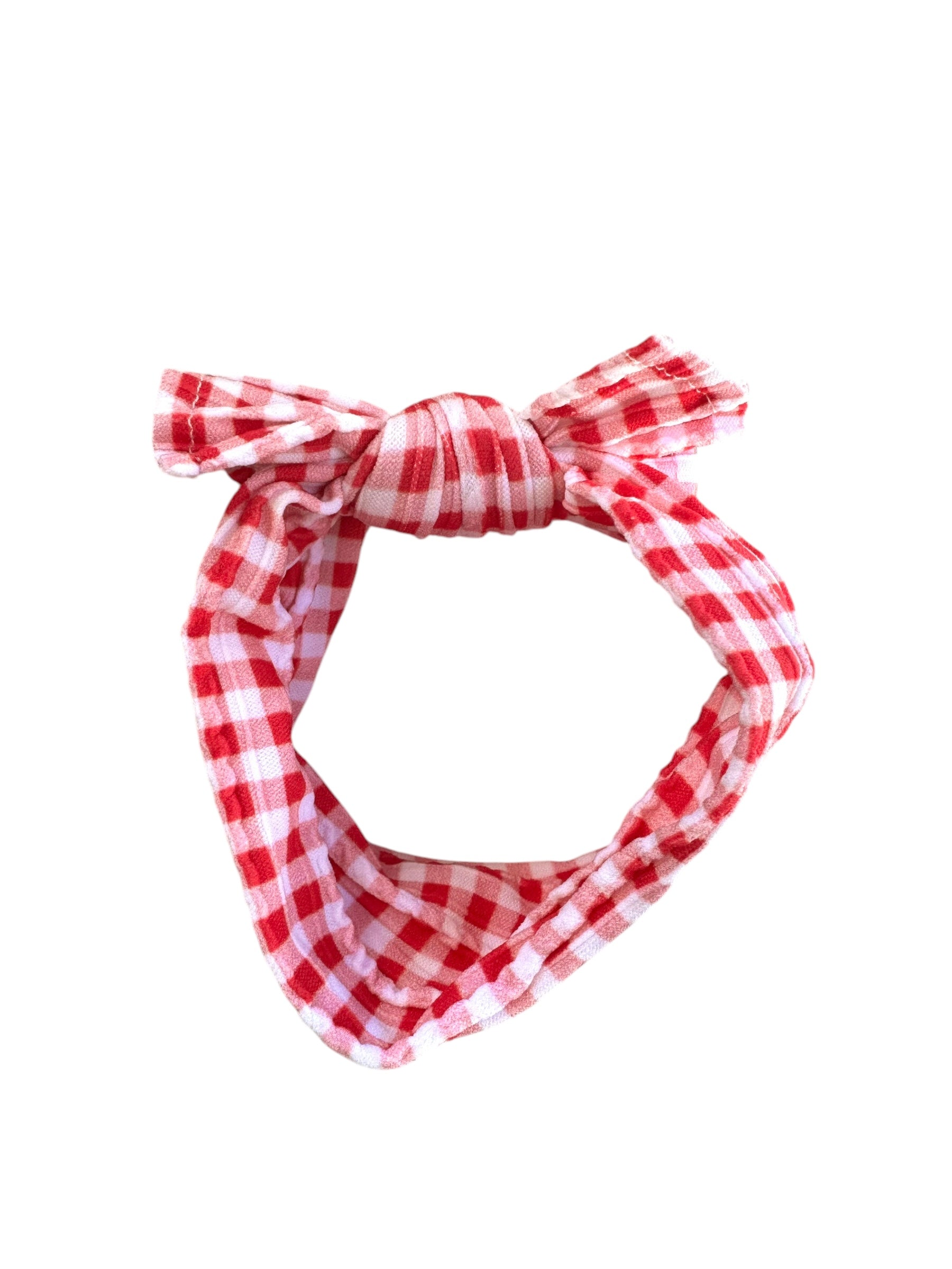 A red plaid patterned infant headband for babies with large bow