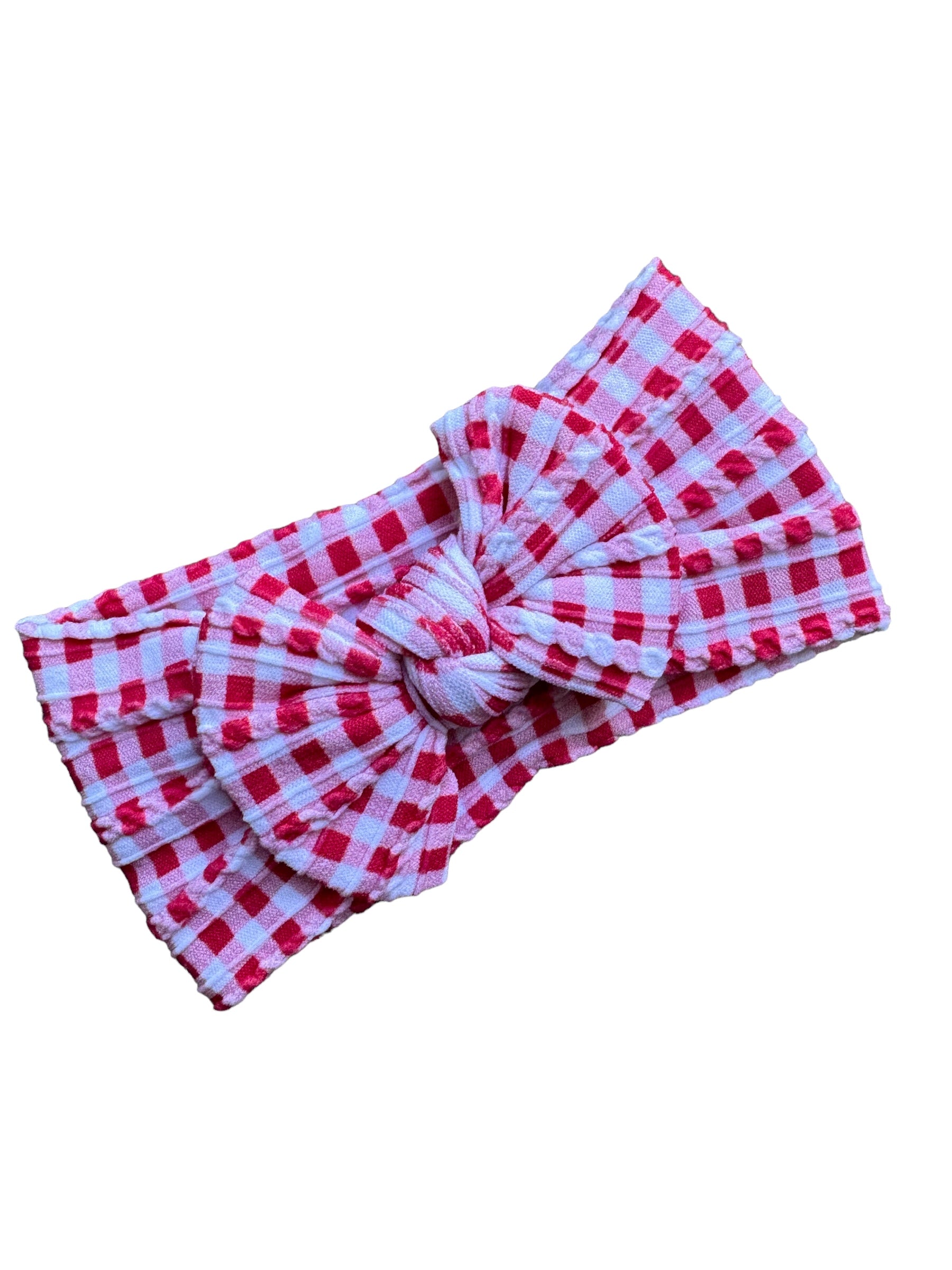 A red plaid patterned nylon headwraps for babies with large bow