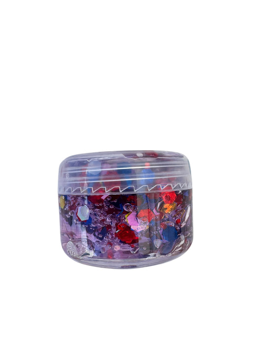 Clear container with colorful glittery hair and body gel on a white background