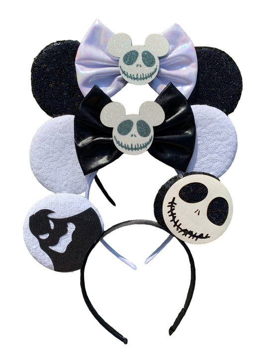 Black and white sequin mouse ear headband with spooky skeleton bow accent