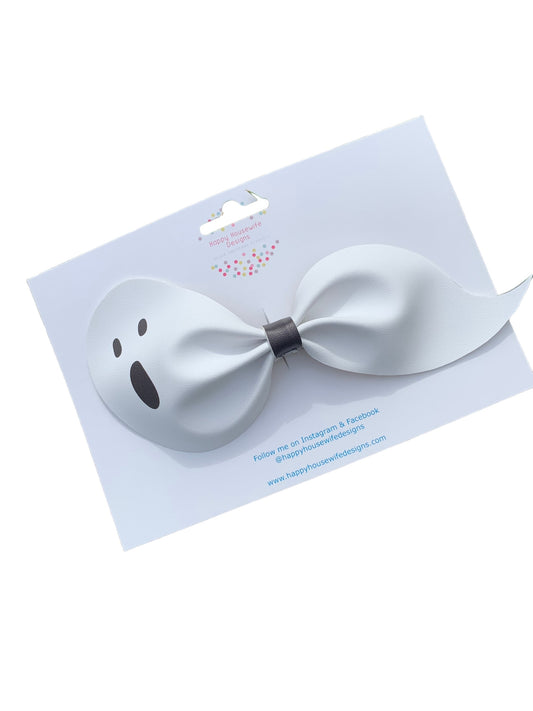 A set of faux leather hair bows in various colors with an alligator clip attached, displayed on a card.