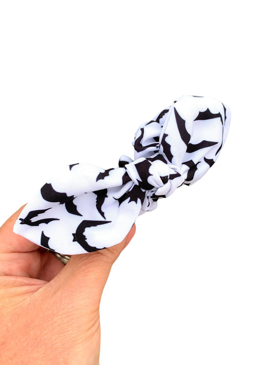white headband with black bats
