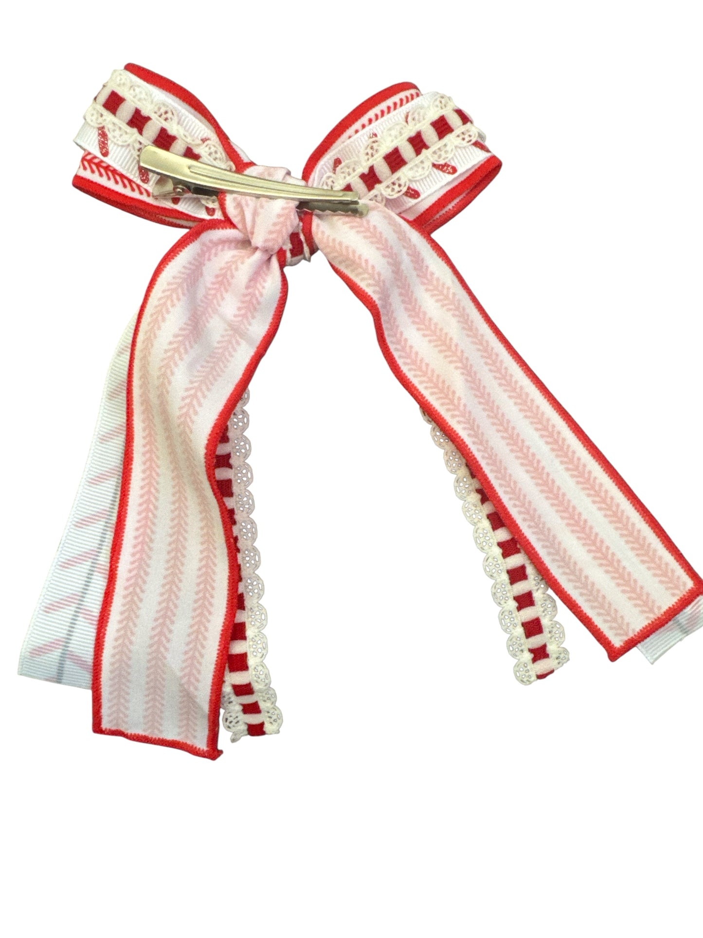 Decorative baseball ribbon hair bow with red and white patterns on a white background on an alligator hair clip