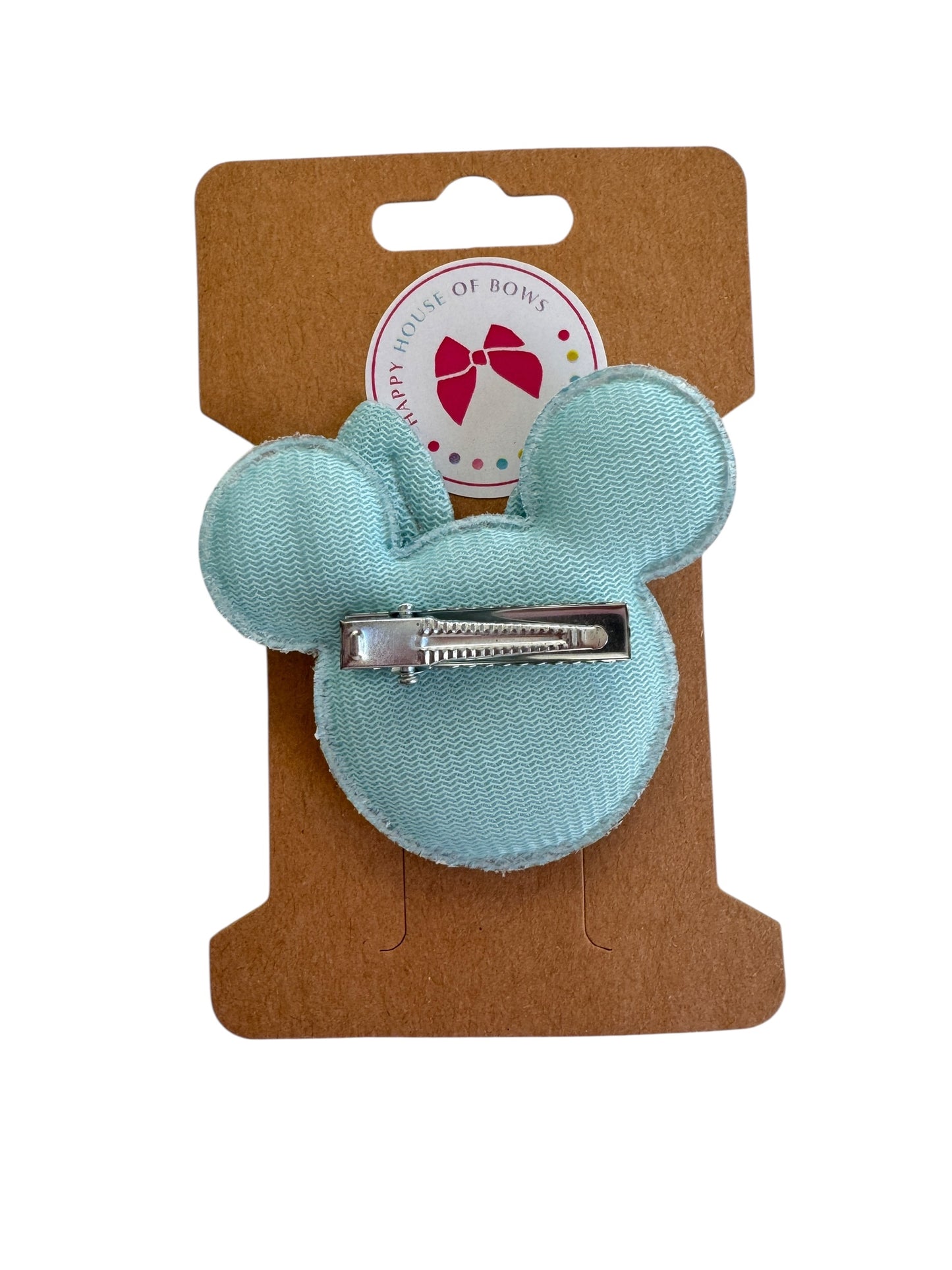 Light blue hair clip on a brown card with a brand logo.