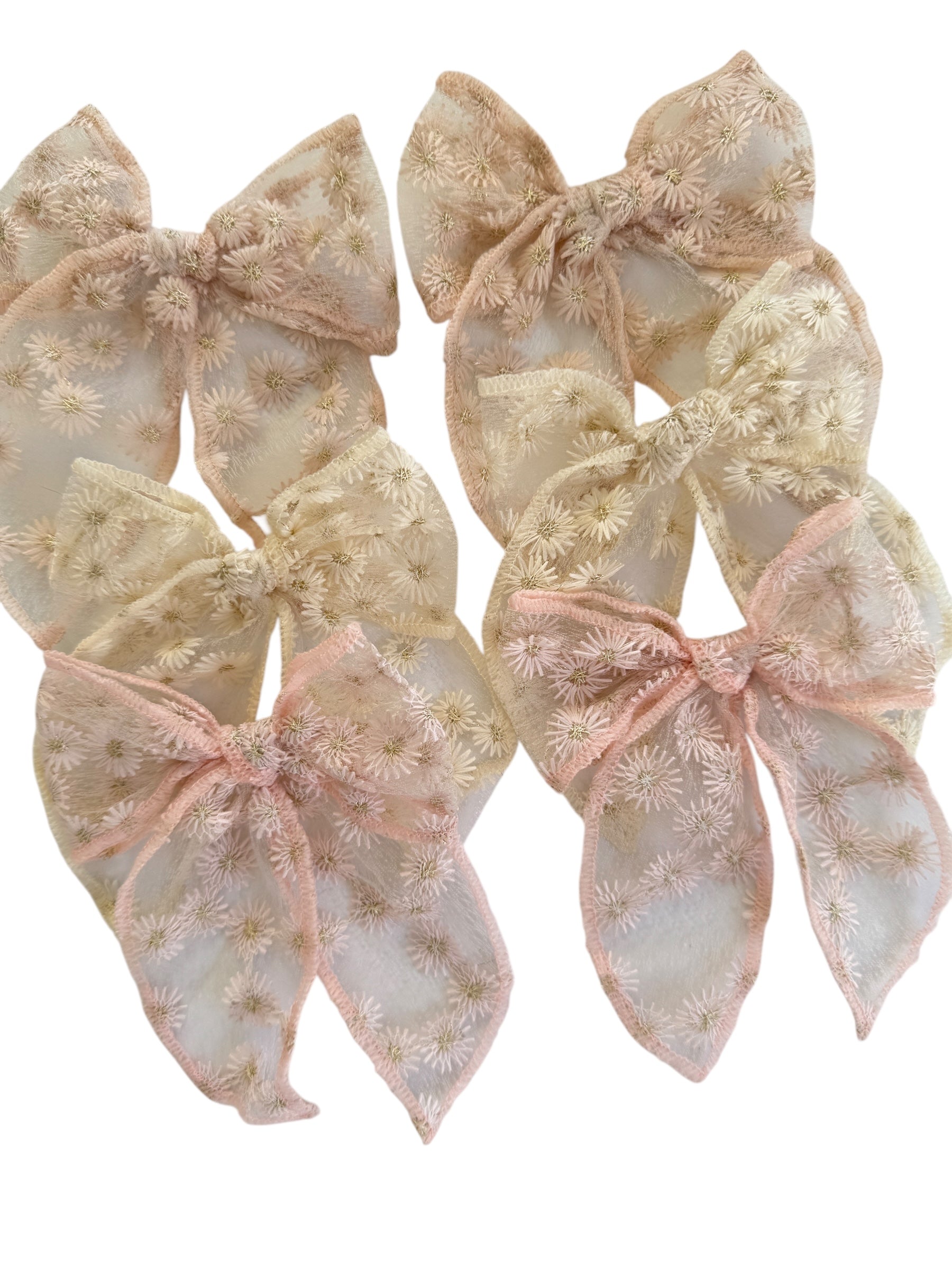 Set of decorative bows with floral patterns on a white background