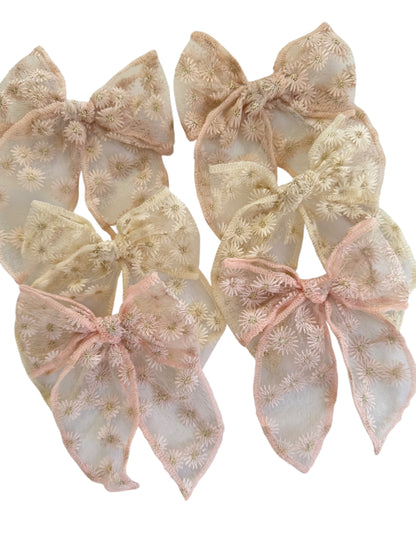 Set of decorative bows with floral patterns on a white background