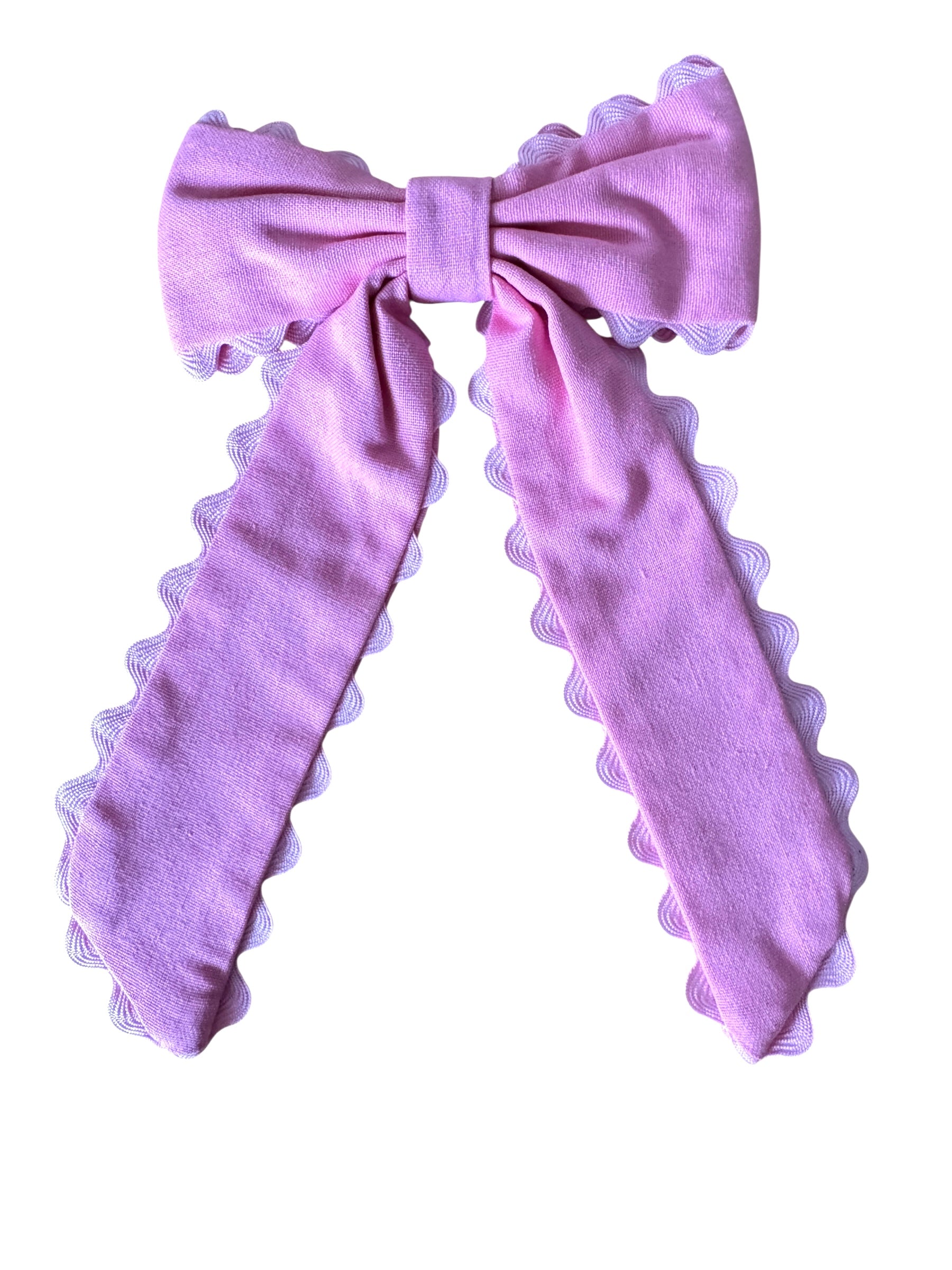 pink bow with scalloped edges on a white background