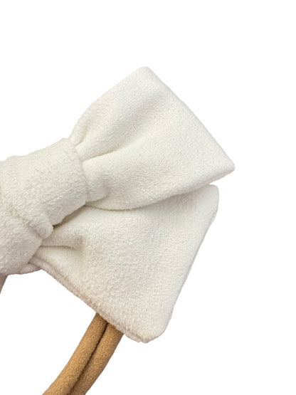 White bow headband on a white background