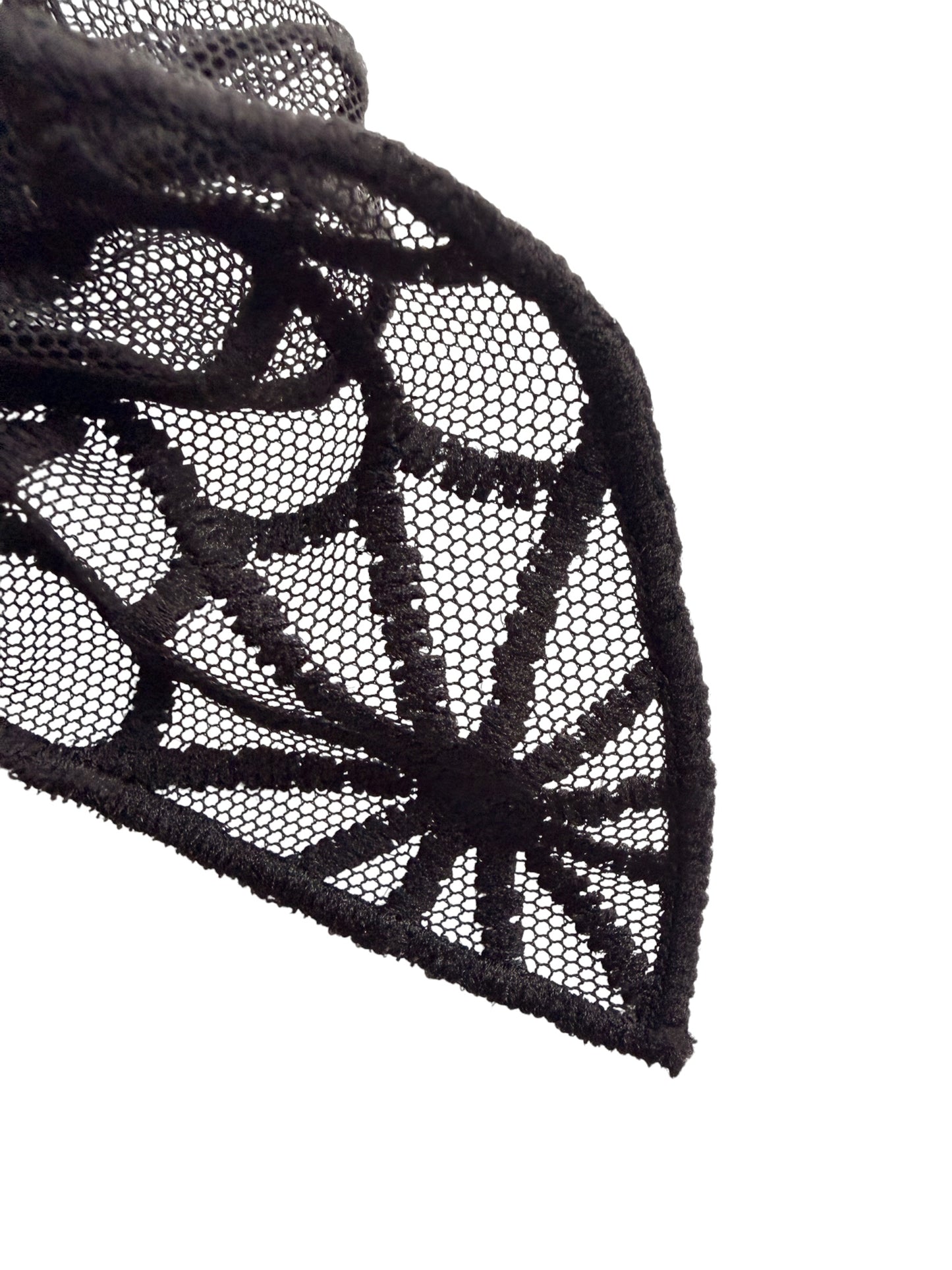 Black lace fabric with a detailed spiderweb pattern, shown draped against a solid white background.