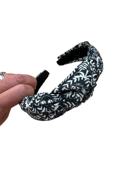 A set of black and white skeleton patterned headband