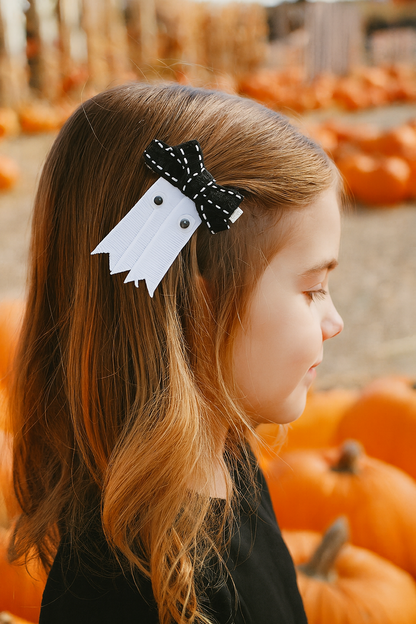 little girl wearing a ghost ribbon clip
