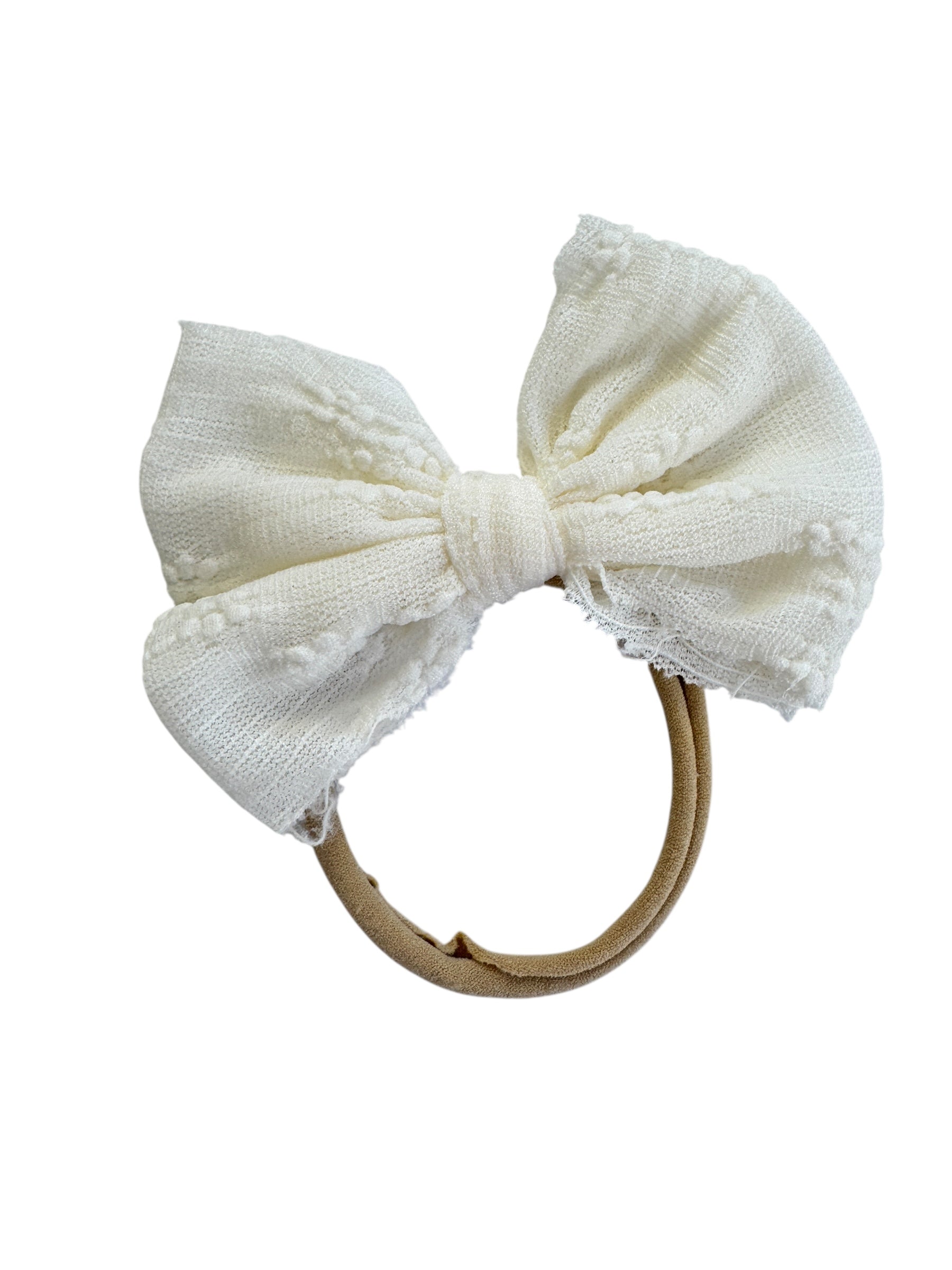 White bow hair accessory on a white background