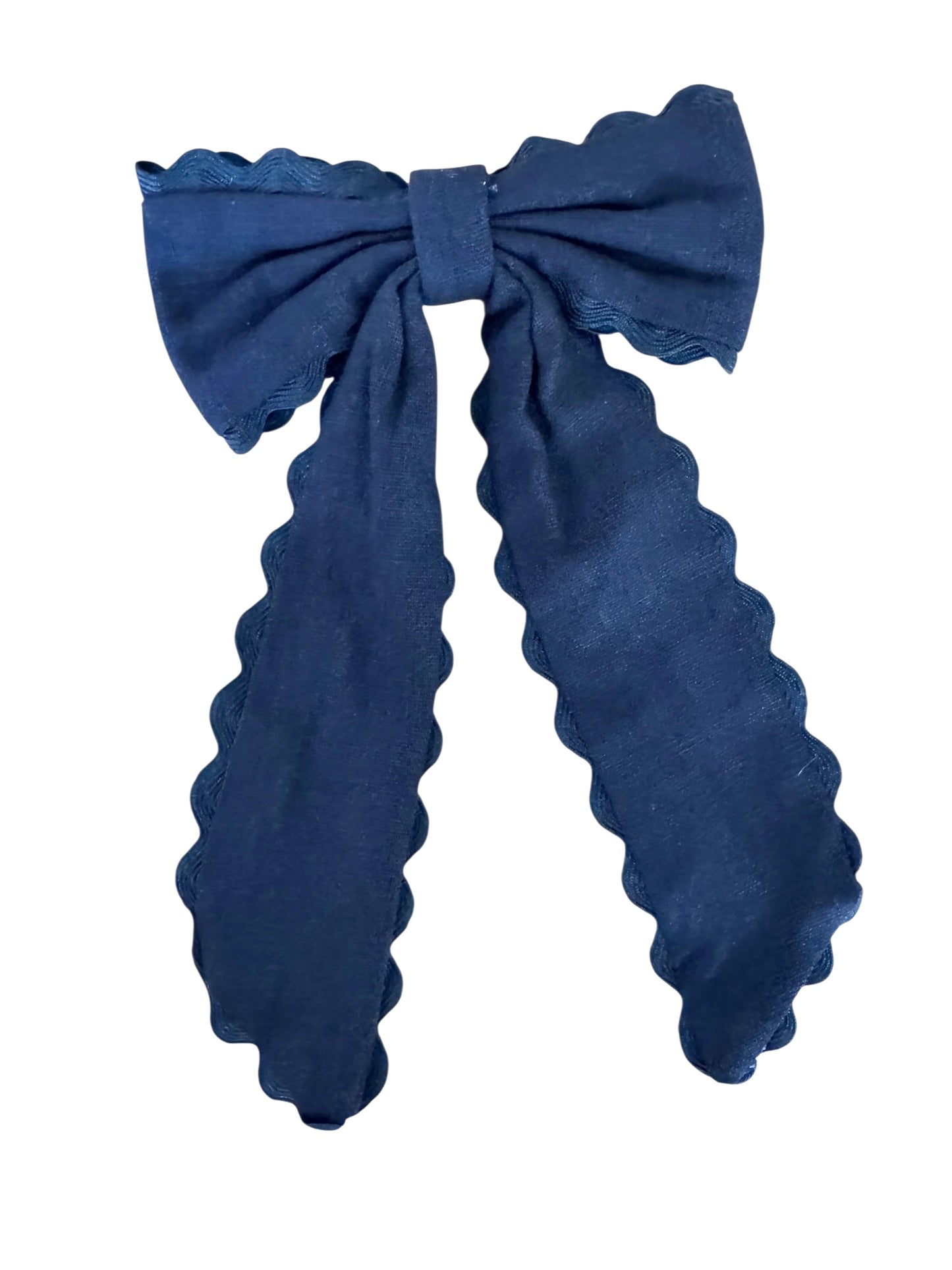 Black bow hair clip on a white background