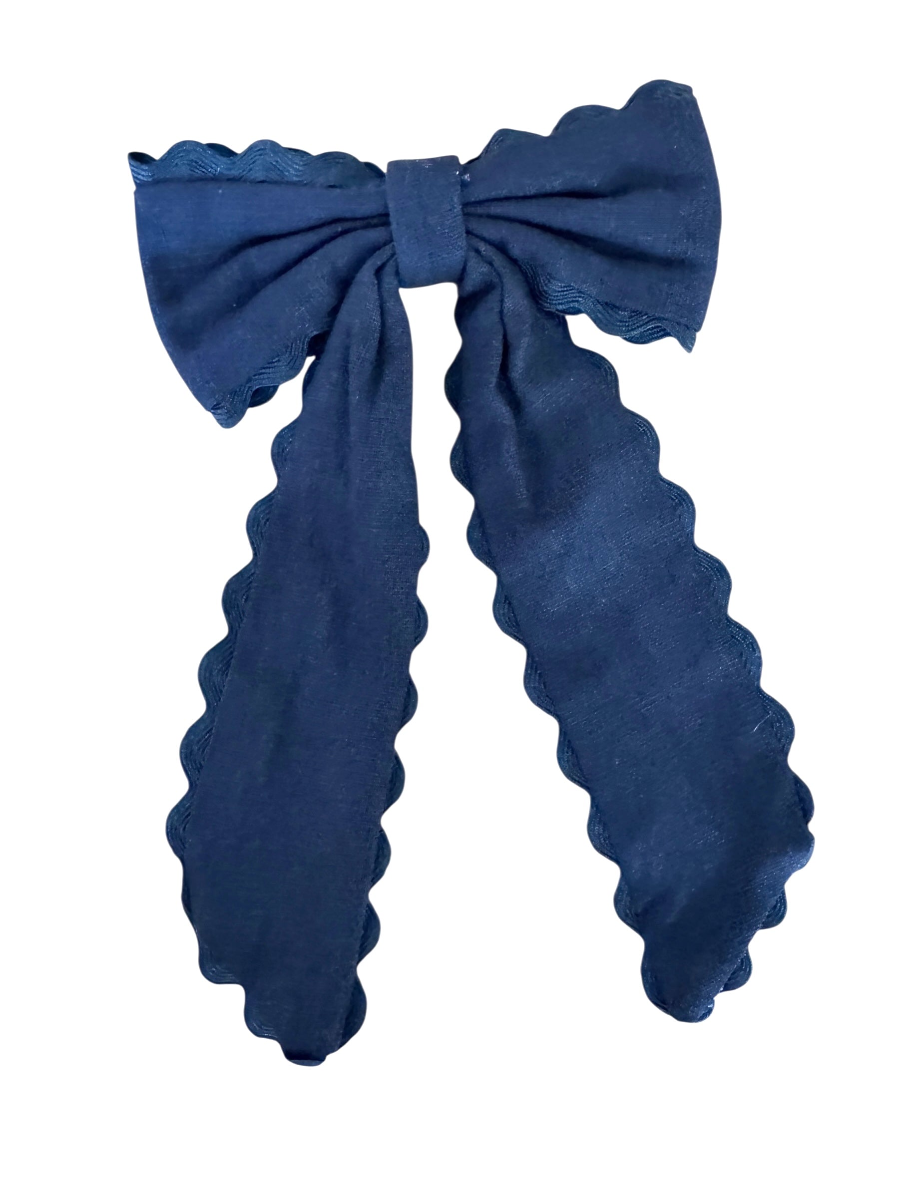 Black bow hair clip on a white background