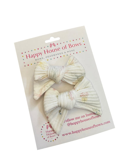 Three decorative bows on a 'Happy House of Bows' branded card.