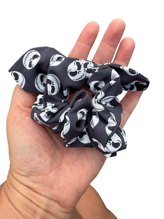 jack skeleton scrunchie in a persons hand