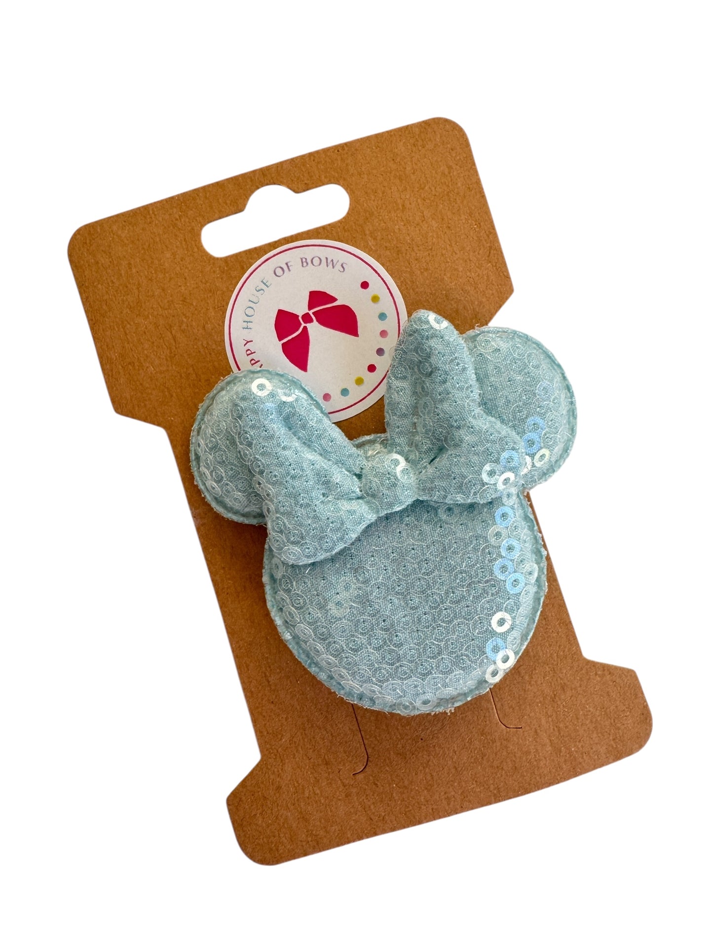 Light blue minnie clip with sequins on a brown card with a brand logo.
