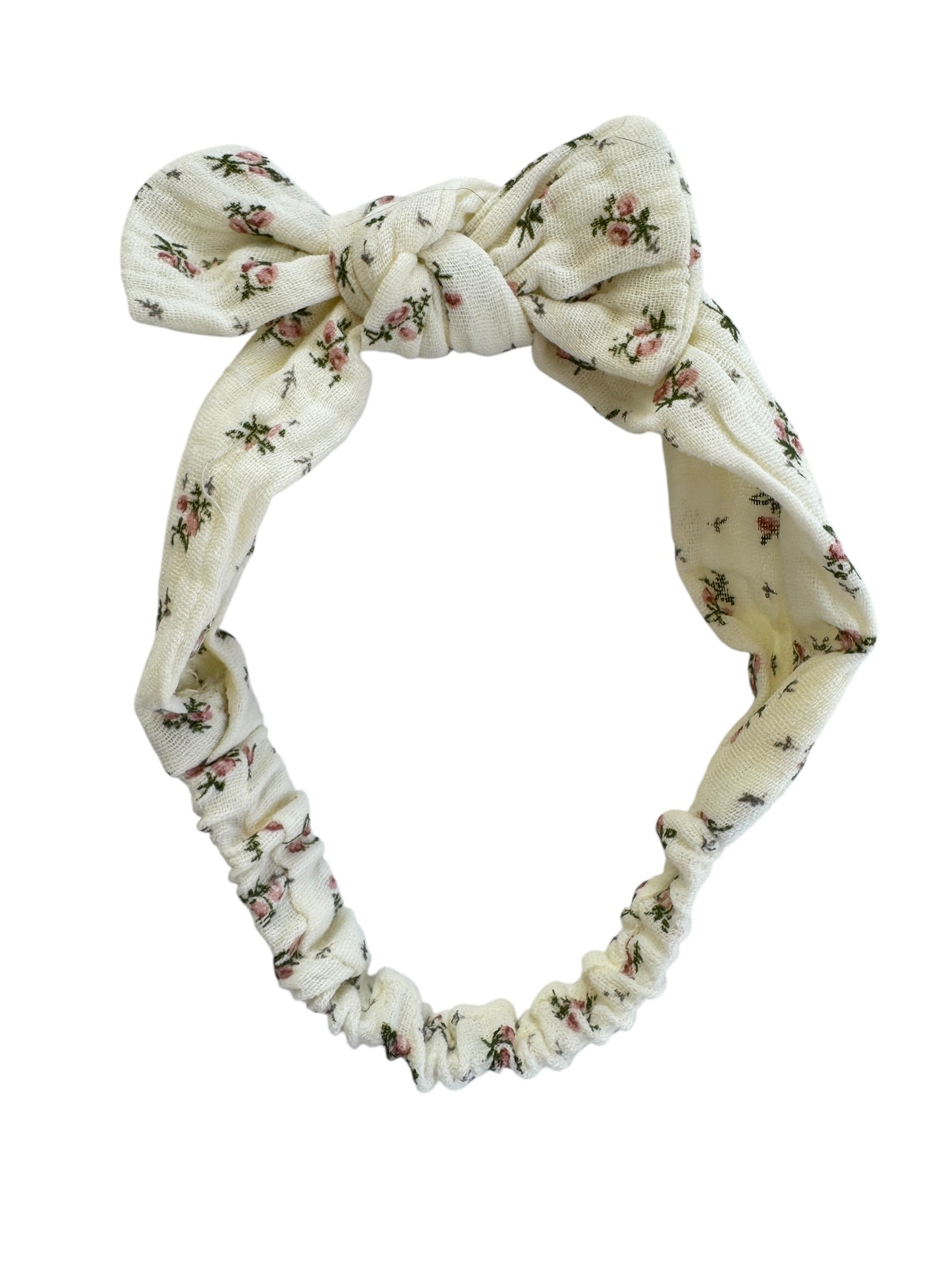 Floral patterned headband with a knot on a white background