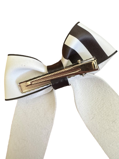 skeleton and striped hair bow on an alligator clip