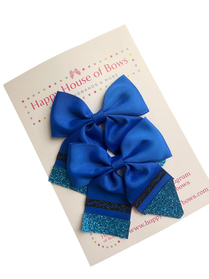 A set of three royal blue hair bows, including two large ribbed grosgrain bows and one smaller glitter bow, displayed on a cream-colored card from Happy House of Bows.