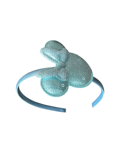Light blue headband with frog-shaped decorations on a white background