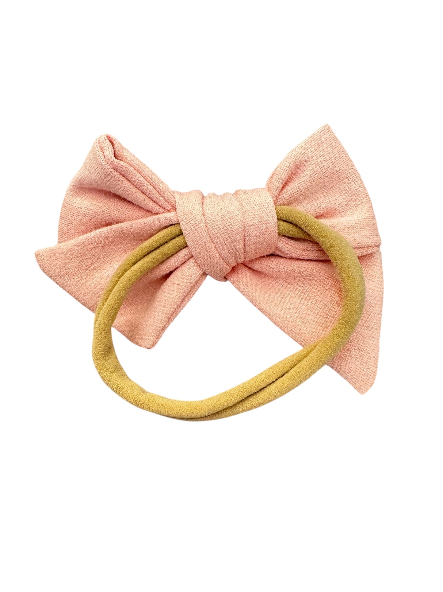 Pink bow hair accessory with a yellow band on a white background