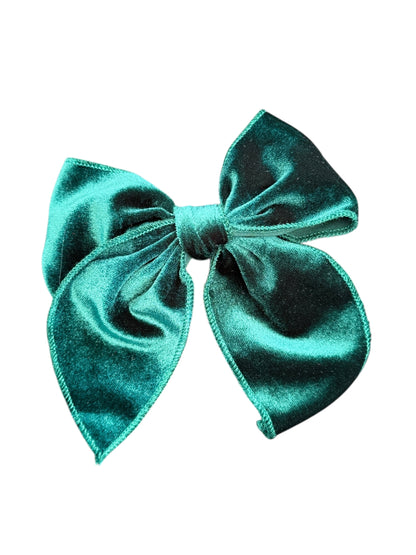 green velvet bow on a white background