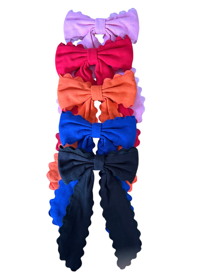 Set of colorful hair bows on a white background