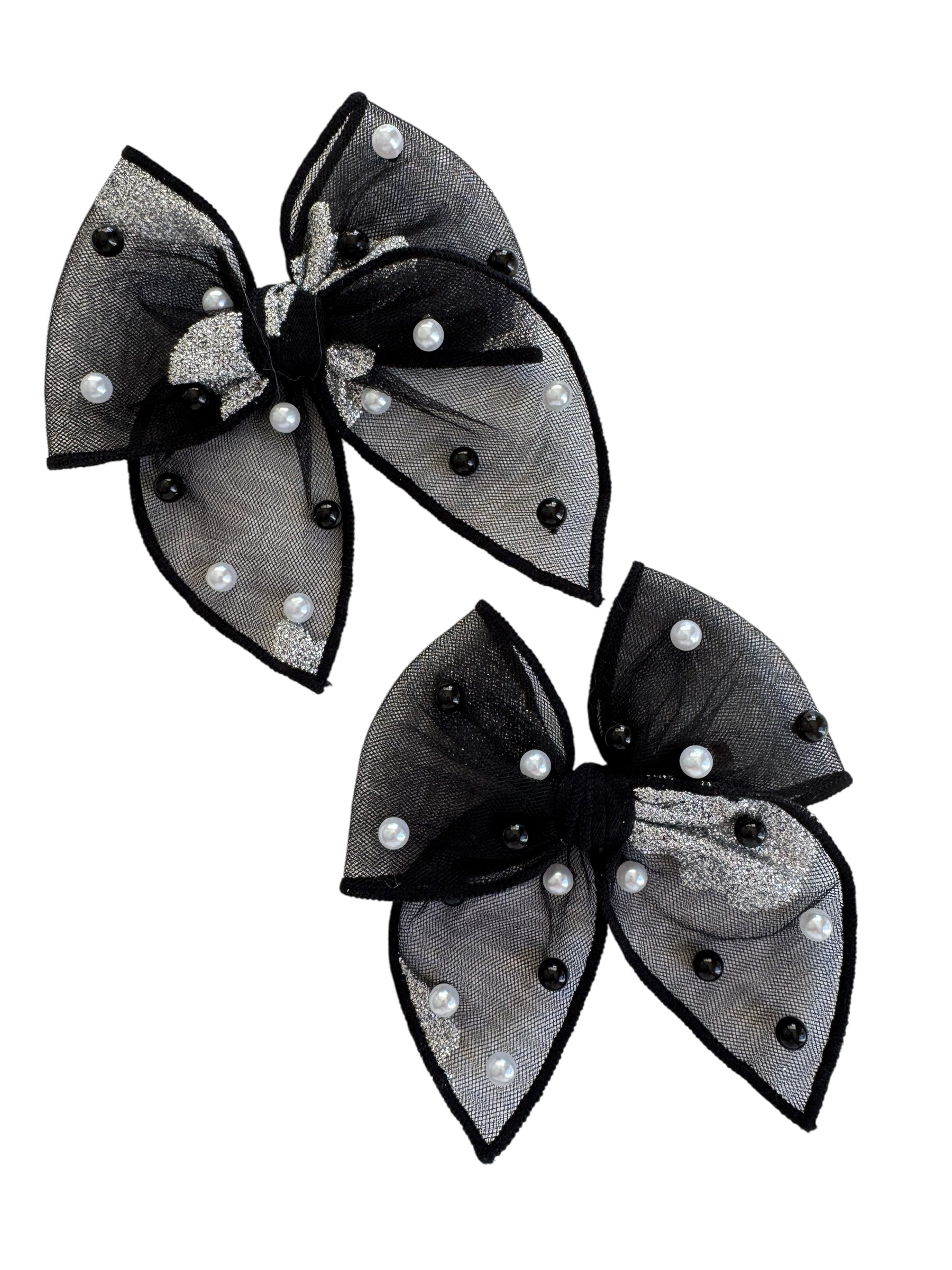 Black hair bows with pearl-like embellishments on a white background