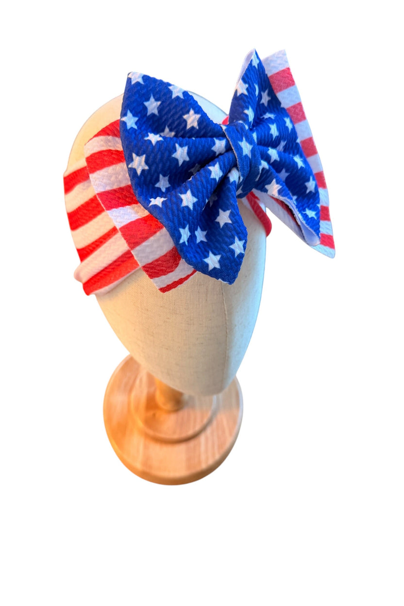 American flag-themed headband on a mannequin head with a white background