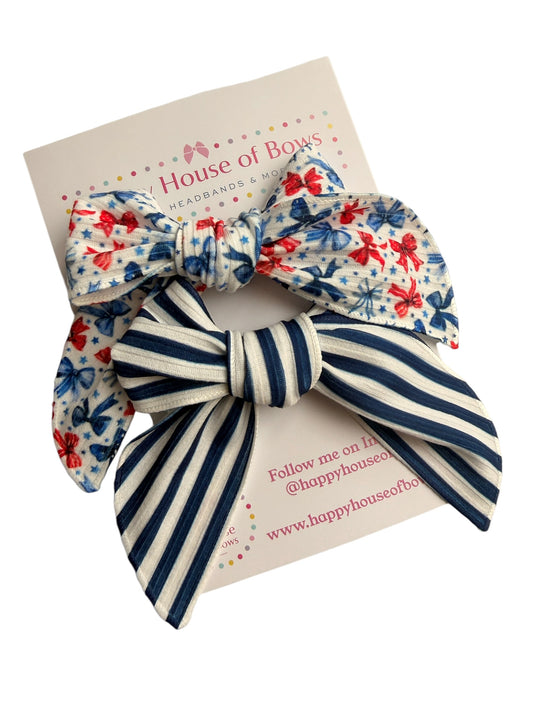Two hair bows on a card with 'House of Bows' branding.
