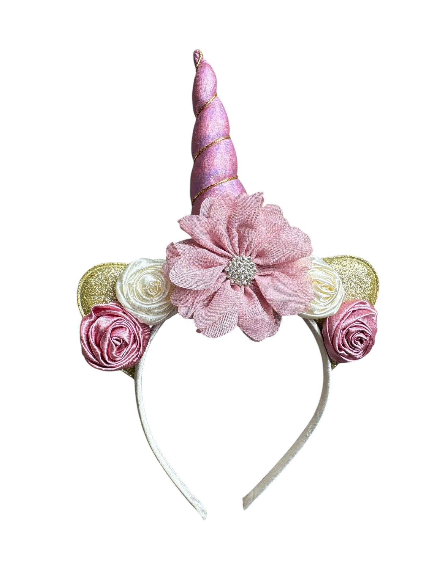 Unicorn headband with pink horn, flowers, and ears on a white background